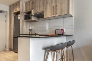 Apartment, 2 Bedrooms | Private kitchen | Fridge, microwave, oven, stovetop - C504 Woodstock Quarters Gym and Pool (Cape Town)