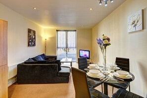 Apartamento conforto | Área de estar | TV de tela plana
