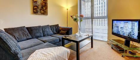 Comfort Apartment | Living room | Flat-screen TV