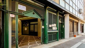 A storefront with a green awning and a sign indicating it is a furniture store. - The House of the Pine Nativity (Napoli)