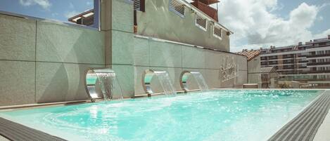 Seasonal outdoor pool, open 10:00 AM to 10:00 PM, sun loungers