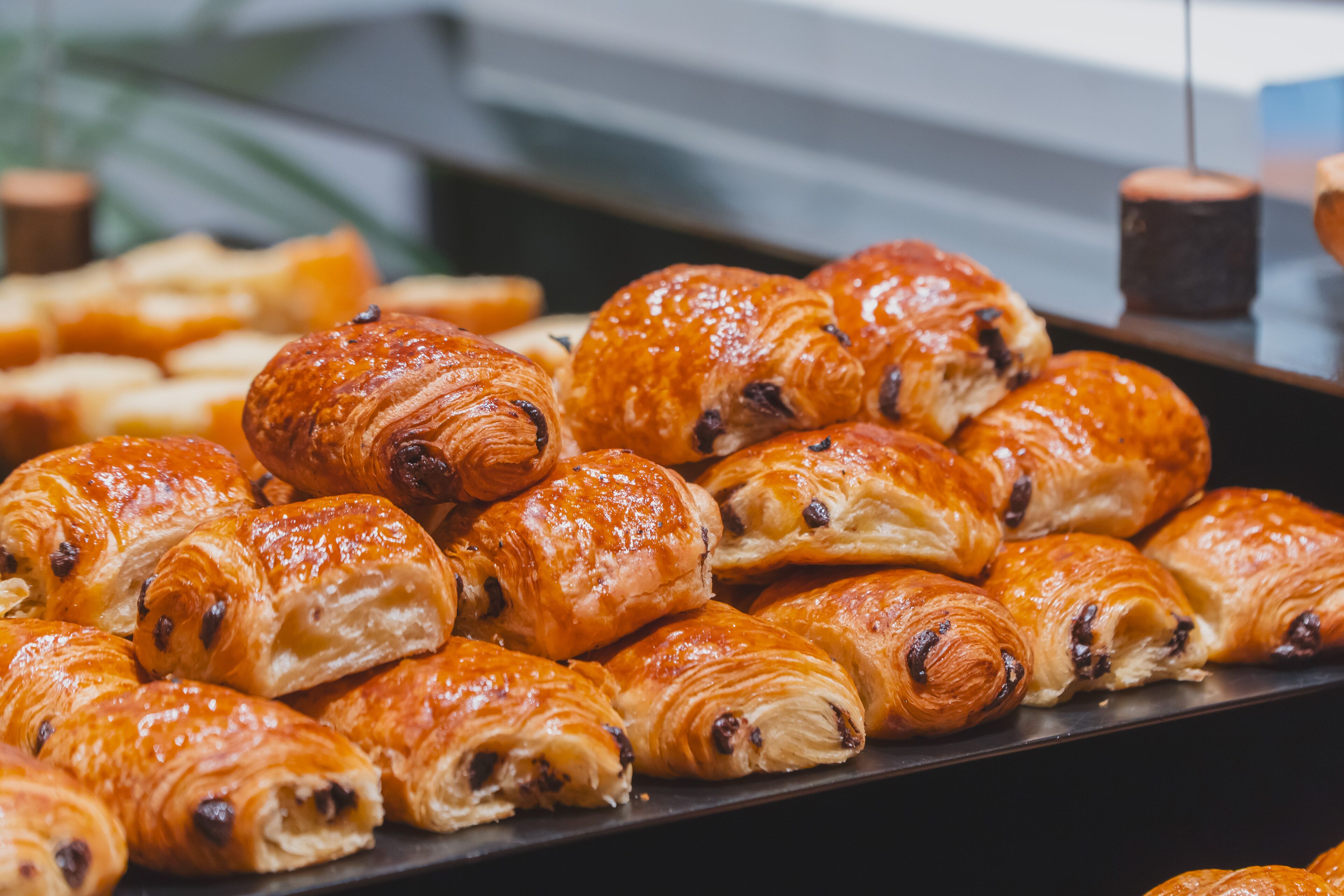 A display of assorted pastries, including croissants and other baked goods.
