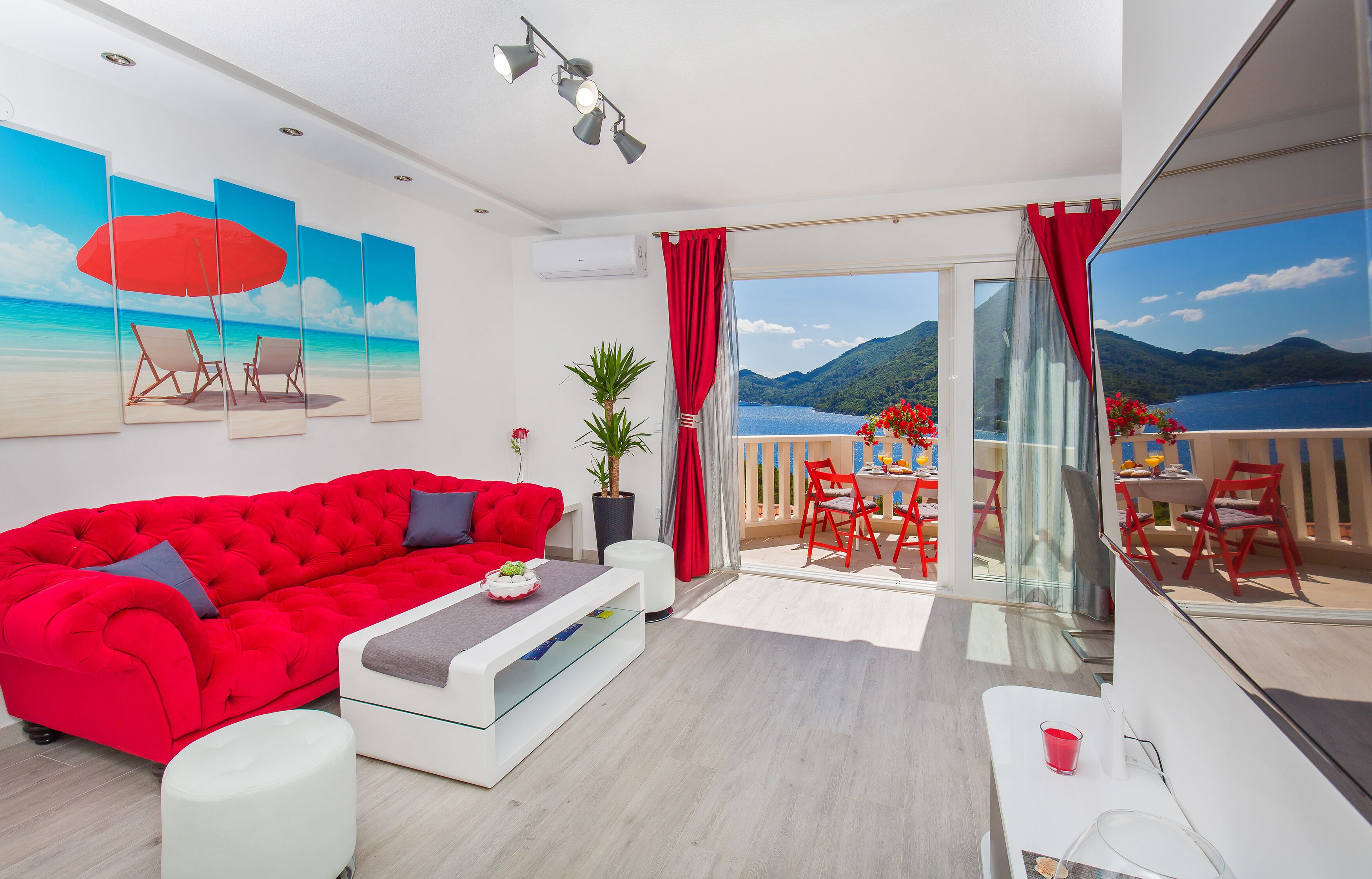 Exclusive Apartment, 2 Bedrooms, Balcony, Sea View | Living room | 42-inch LED TV with satellite channels, TV, heated floors