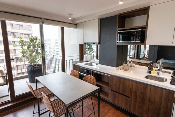 Penthouse, 1 King Bed, Terrace | Private kitchen | Fridge, microwave, oven, stovetop