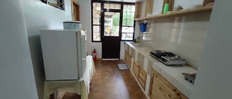 Fridge, microwave, stovetop, cookware/dishes/utensils