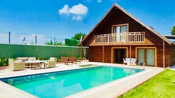 Seasonal outdoor pool, pool umbrellas, pool loungers