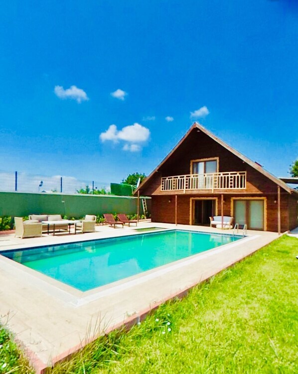 Seasonal outdoor pool, pool umbrellas, pool loungers