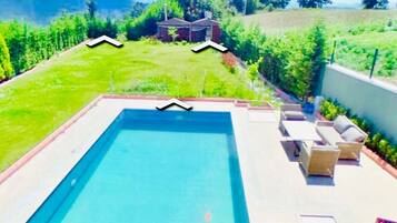 Seasonal outdoor pool, pool umbrellas, sun loungers