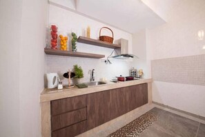 One Bedroom Apartment | Private kitchenette | Full-sized fridge, microwave, stovetop, coffee/tea maker - AnCasa by Ambassadors Suite (Port Dickson)