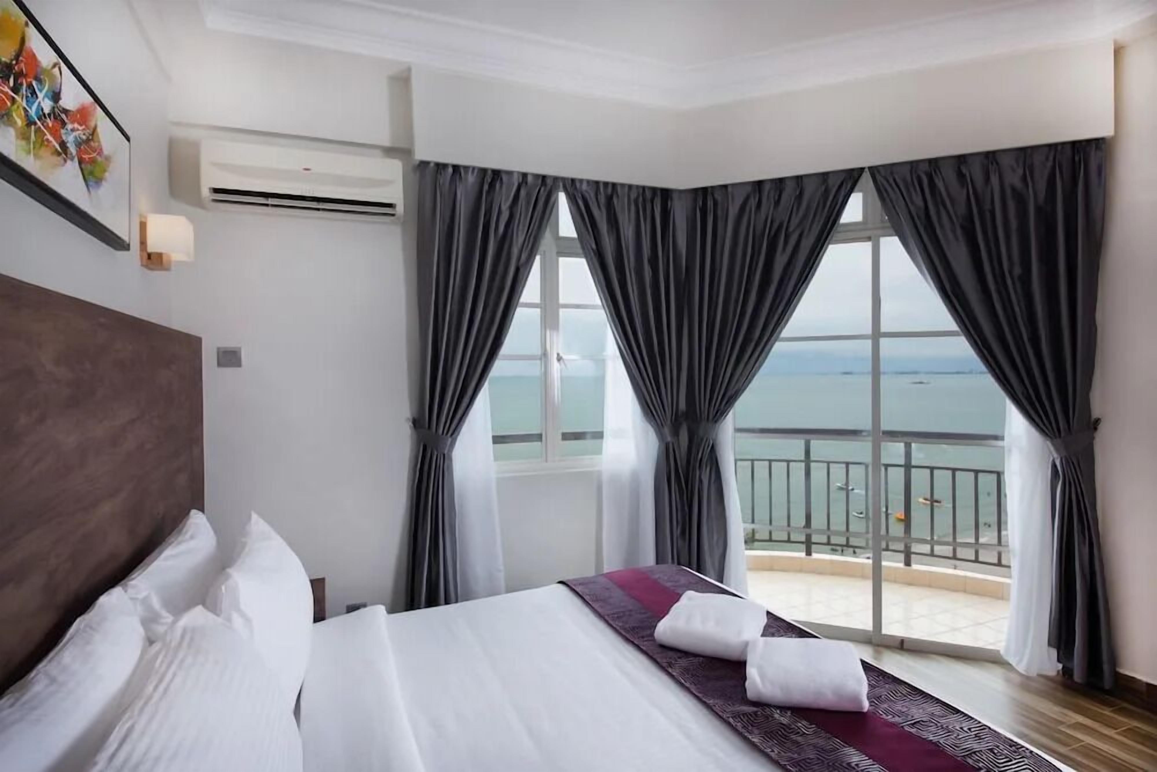 Three Bedroom Apartment | Desk, laptop workspace, iron/ironing board, bed sheets