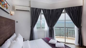 Three Bedroom Apartment | Desk, laptop workspace, iron/ironing board, bed sheets