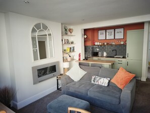 TV, fireplace, books