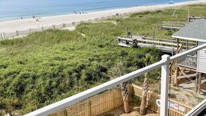 A pool area with a view of the beach and ocean. - "Be Still" - Oceanfront Home w/ Private Pool, 4 Bedrooms / 3.5 Bathrooms (Holden Beach)