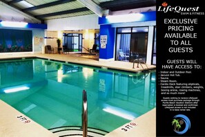 Relax by the pool, featuring a clear water surface and a lifeguard stand for added safety.