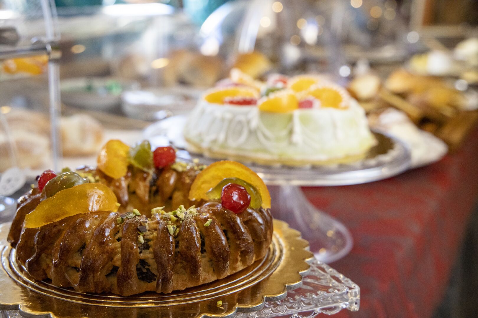 A dessert display with various cakes and pastries.