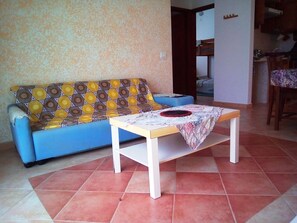 Appartement Confort, 3 chambres | Aire de séjour | Téléviseur à écran plat