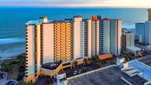 A high-rise hotel with multiple balconies overlooking the beach. - Ocean Front Condos at Patricia Grand (Myrtle Beach)