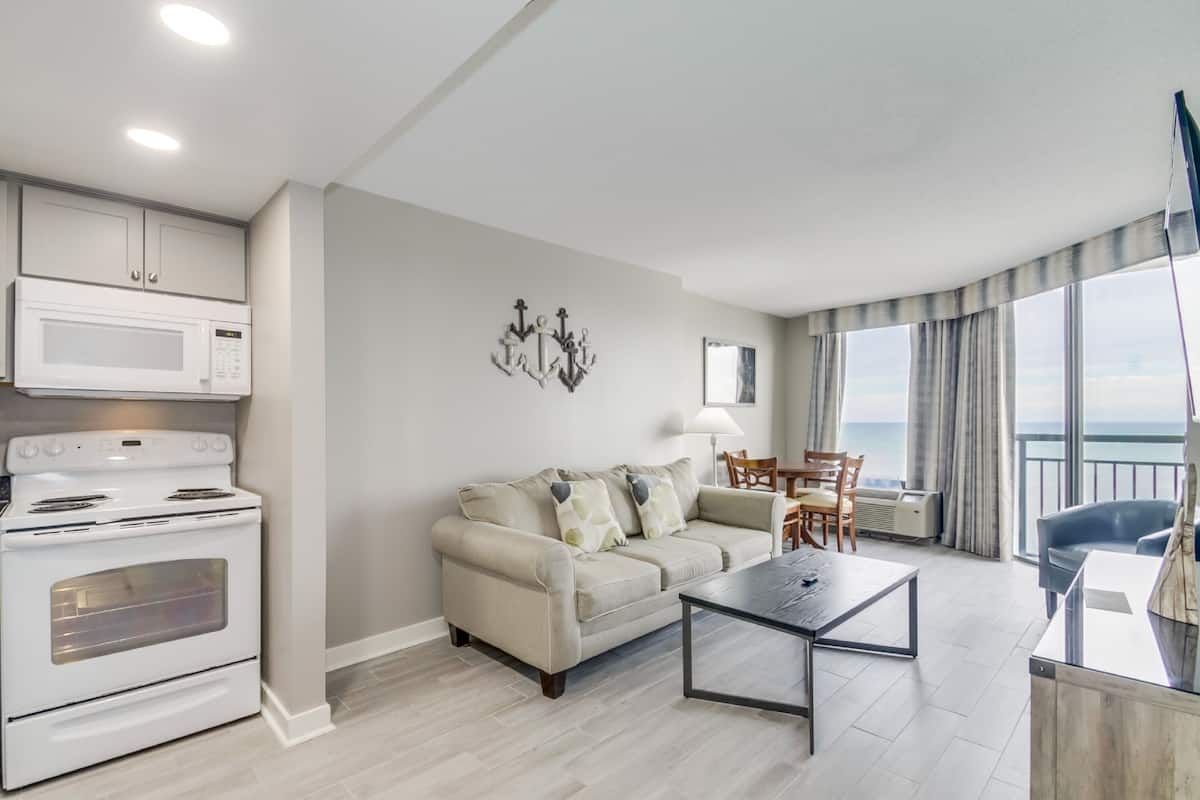 Premium Condo, 1 Bedroom, Balcony, Beach View | Living room | 42-inch Smart TV with cable channels