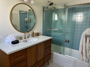 Combined shower/tub, hair dryer, towels, soap