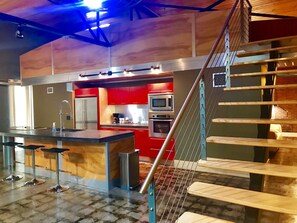 Loft 007 Ft. on HGTV | Private kitchen | Full-size fridge, microwave, oven, stovetop - The Hangar Lofts Hotel (Columbia)