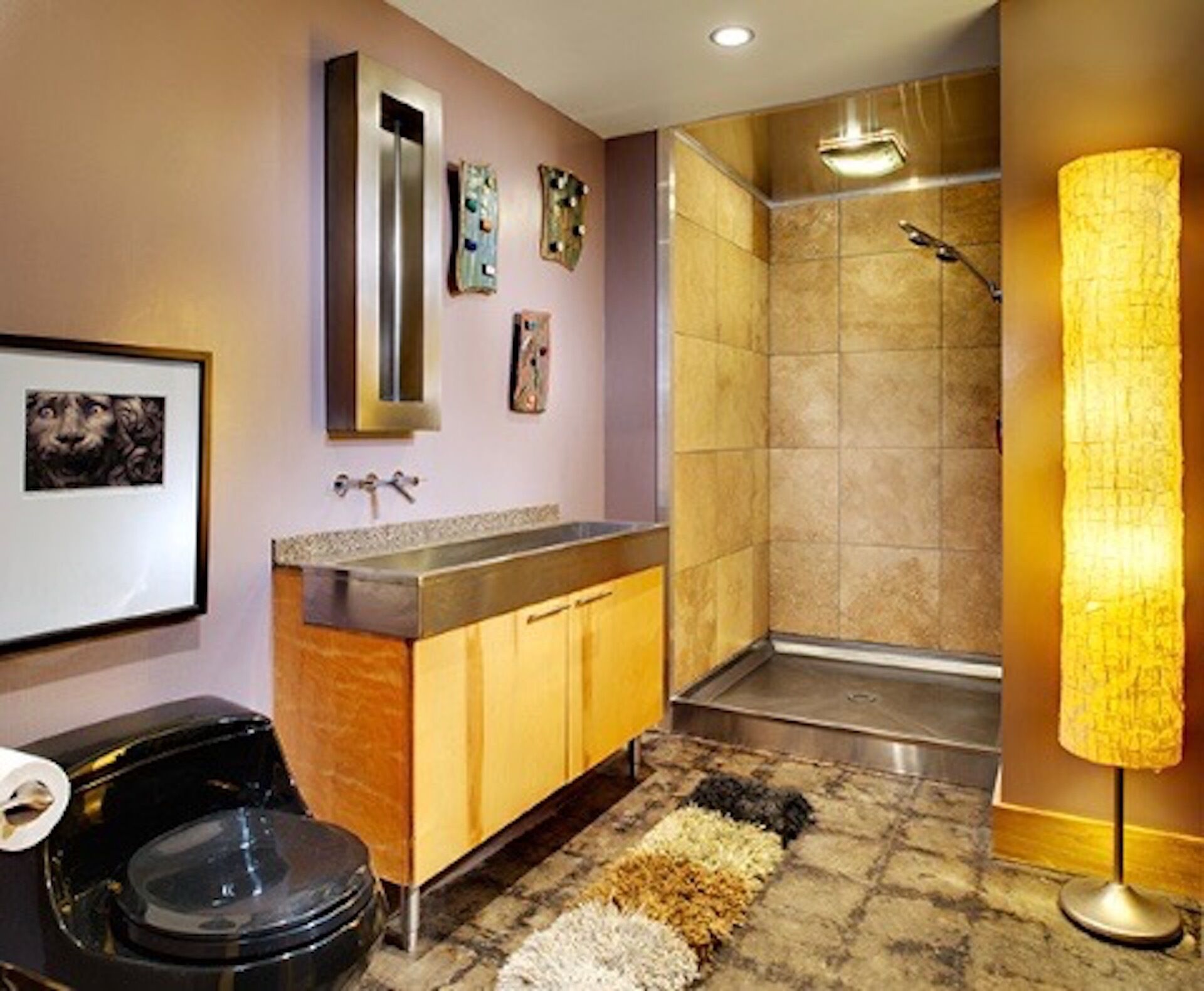 A bathroom with a shower, sink, and toilet.