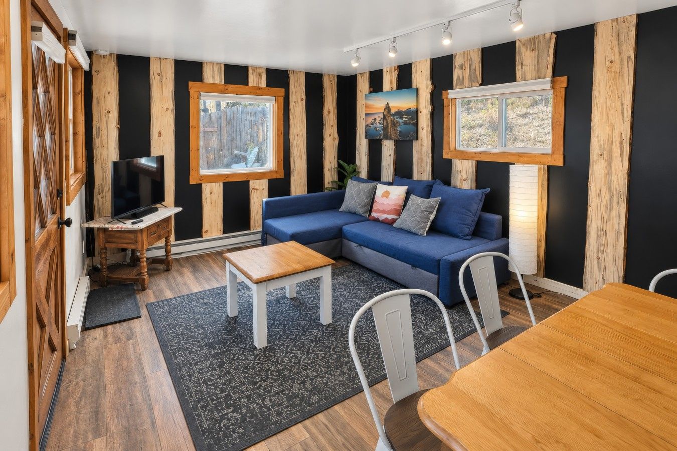 A woodsy-inspired living room with live edge slabs