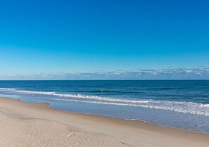 A beach with a clear sky and calm sea. - Anchors Away - Stunning 5BR Oceanfront Home - Elevator, Comm. Pool (Surf City)