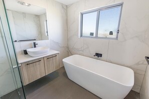 Bathtub, hair dryer, towels