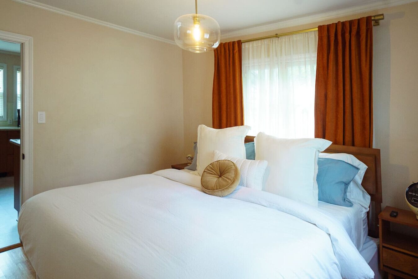 Spacious bedroom featuring a luxurious king-size bed for the ultimate comfort and relaxation.