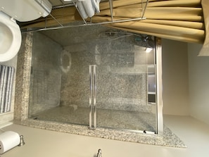Shower, hair dryer, towels, shampoo