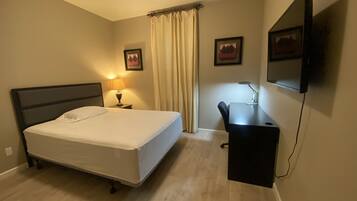 1 bedroom, desk, iron/ironing board, travel crib