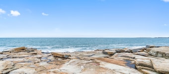 Sweeping, dog-friendly, waterfront home w/ a sun room, ocean views, & fireplaces
