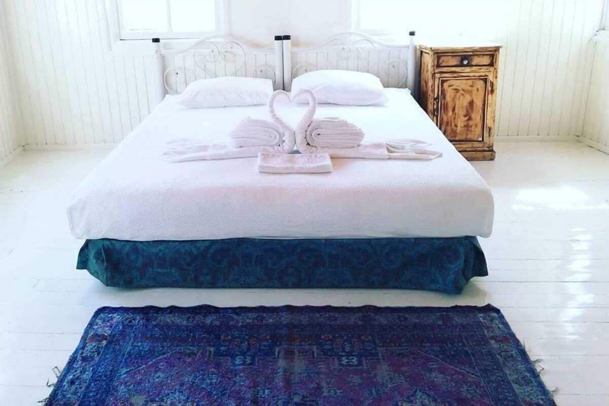 Quadruple Room, Shared Bathroom | Desk, laptop workspace, blackout drapes, iron/ironing board