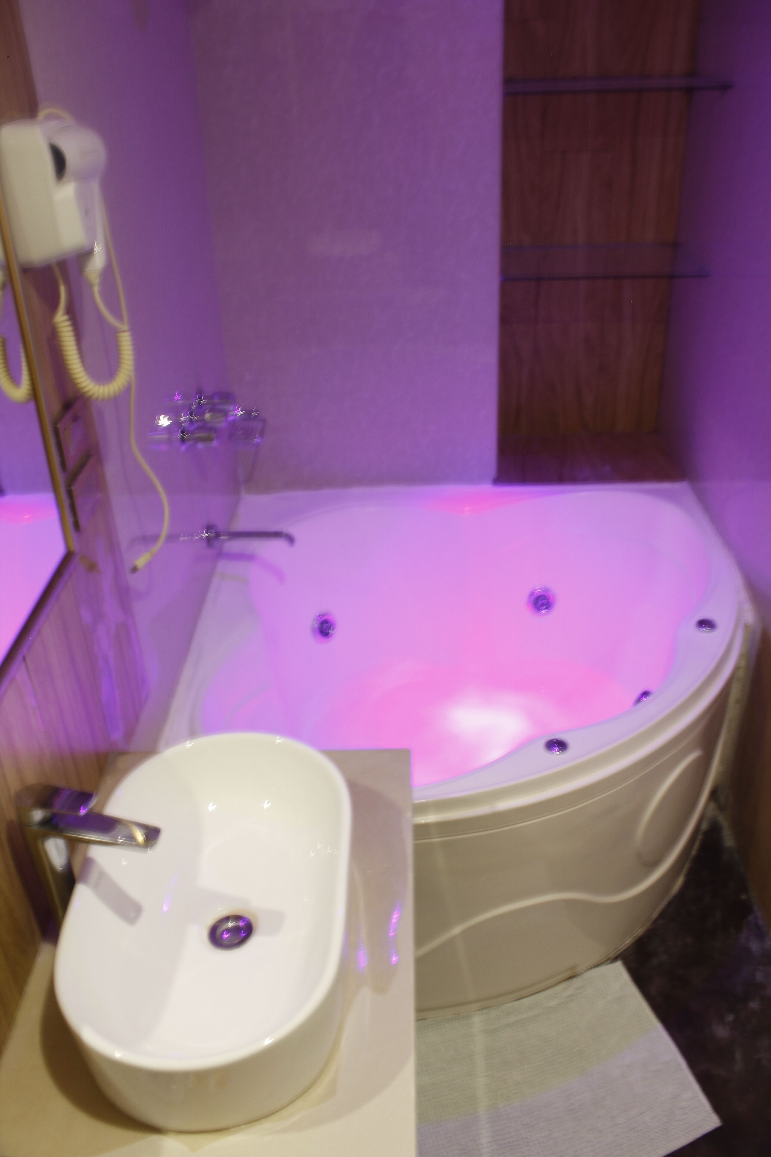 A bathroom with a bathtub, a sink, and a shower.