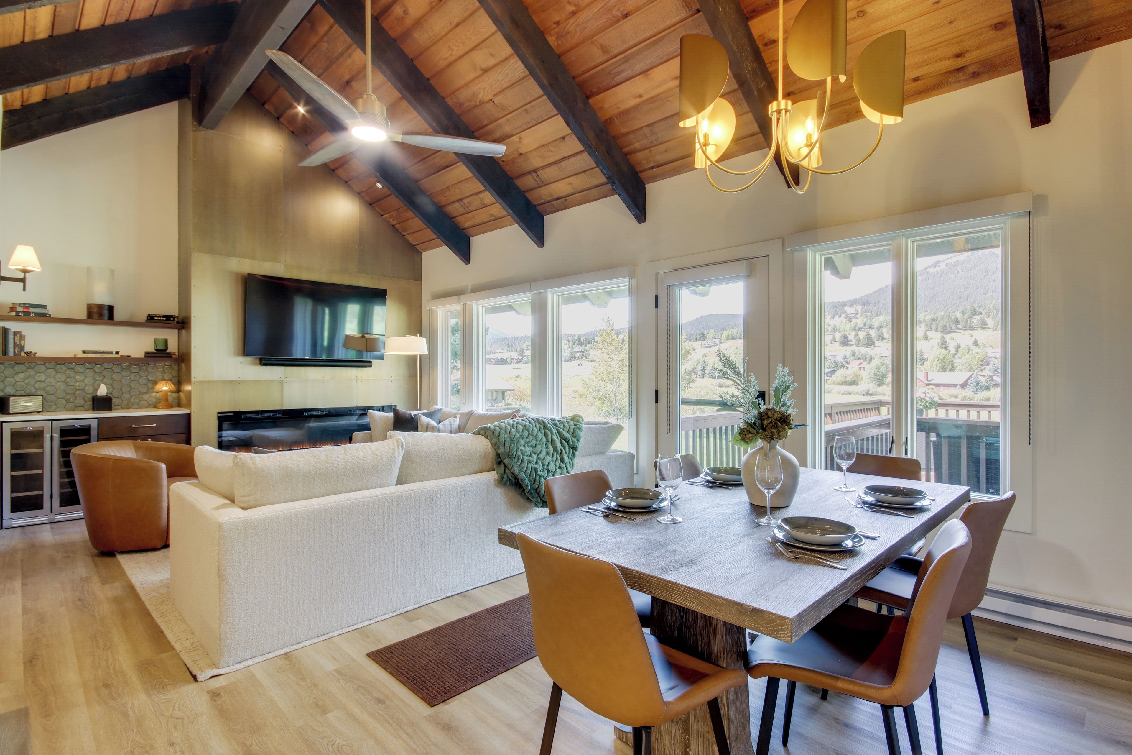 A modern interior with a dining area, kitchen, and living space.