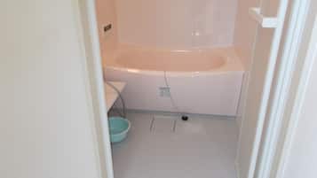 Twin Room | Bathroom | Hair dryer, slippers, towels