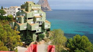 A multi-story building with balconies overlooking a coastal area. - Muralla Roja by Interhome (Calpe/Calp)