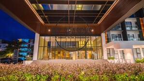 A modern building with a prominent entrance and a sign that reads "A season to be remembered." - Timurbay Seafront by My Seasons (Kuantan)