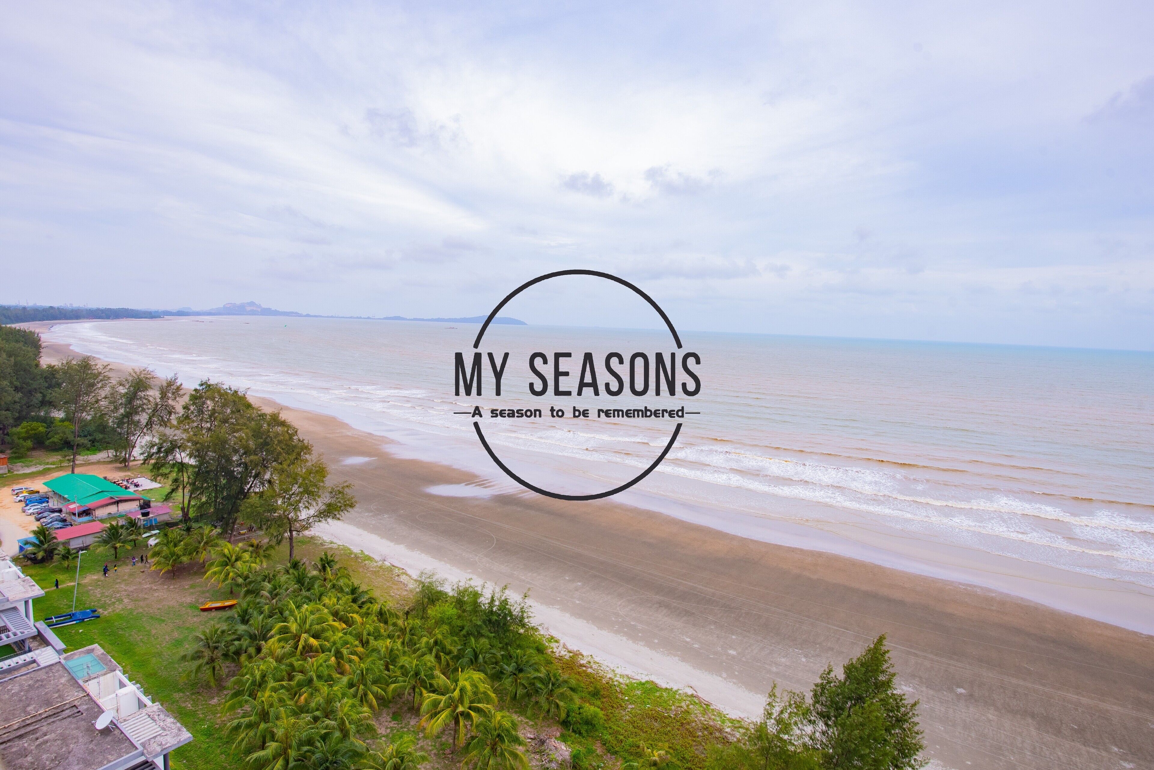 A beach view with a logo "MY SEASONS A season to be remembered" in the center.