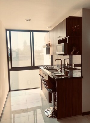 Mini-fridge, microwave, oven, stovetop