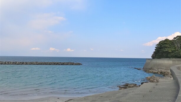 A coastal scene with a clear sky, calm sea, and a rocky outcrop. - Koinami (Shima)