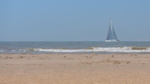 A sailboat on a calm sea with a clear sky. - Enjoy with parking by Interhome (De Haan)