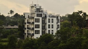 A multi-story building with a modern architectural design, featuring balconies and large windows. - Sky 14 Hotel Apartments (Malabe)