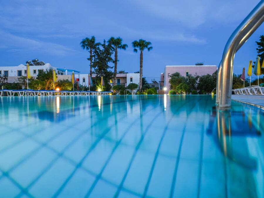 Seasonal outdoor pool, open 7:00 AM to 9:00 PM, pool loungers