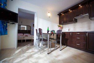 Comfort Apartment | Living area | Flat-screen TV