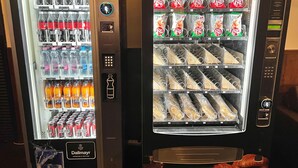 Two vending machines with various beverages and snacks. - MP Hostel Budapest (Budapest)