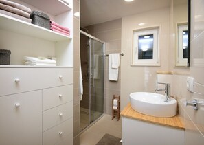 Shower, free toiletries, hair dryer, bathrobes