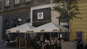 A café with outdoor seating, a Pepsi Cola sign, and a chalkboard menu. - Budapest Passage 1 (Budapest)