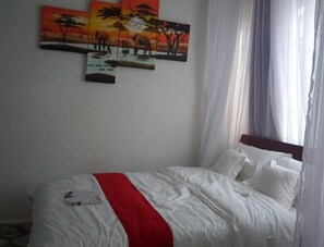 Standard Single Room | Memory-foam beds, blackout curtains, free WiFi, bed sheets - Nyamindi Resort (Mururi)