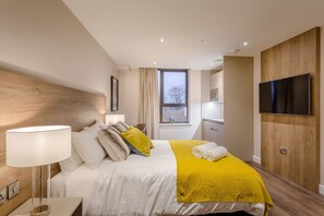 Luxe beddengoed, geluiddichte muren, een strijkplank/strijkijzer